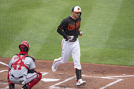 Jul 25, 2021; Baltimore, Maryland, USA; Baltimore Orioles designated hitter Trey Mancini (16) crosses home plate after hitting a home run during the first inning against the Washington Nationals at Orioles Park at Camden Yards. Mandatory Credit: Gregory Fisher-USA TODAY Sports