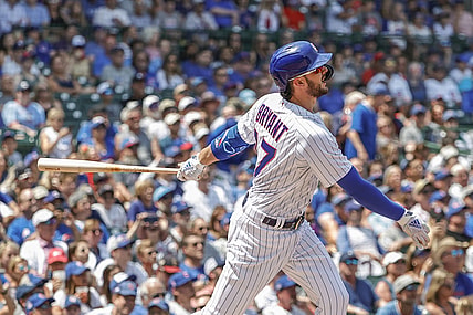 Jul 25, 2021; Chicago, Illinois, USA; Chicago Cubs third baseman Kris Bryant (17) hits a two-run home run against the Arizona Diamondbacks during the first inning at Wrigley Field. Mandatory Credit: Kamil Krzaczynski-USA TODAY Sports