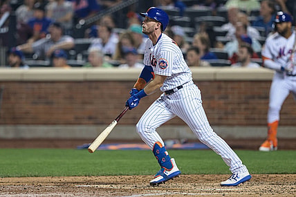Jul 26, 2021; New York City, New York, USA;  New York Mets third baseman Jeff McNeil (6) hits an RBI double during the fifth inning against the Atlanta Braves  at Citi Field. Mandatory Credit: Vincent Carchietta-USA TODAY Sports