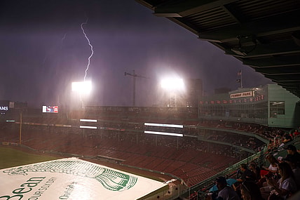 Jul 27, 2021; Boston, Massachusetts, USA; Lightning strikes outside Fenway Park during a rain delay between the Toronto Blue Jays and the Boston Red Sox. Mandatory Credit: Paul Rutherford-USA TODAY Sports