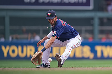 Jul 28, 2021; Minneapolis, Minnesota, USA; Minnesota Twins shortstop Andrelton Simmons (9) fields a ground ball against the Detroit Tigers in the fourth inning at Target Field. Mandatory Credit: Brad Rempel-USA TODAY Sports