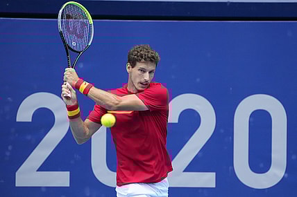 Jul 30, 2021; Tokyo, Japan; Pablo Carreno Busta (ESP) returns a shot from Karen Khachanov (ROC) in the men's singles semifinals during the Tokyo 2020 Olympic Summer Games at Ariake Tennis Park. Mandatory Credit: Robert Deutsch-USA TODAY Sports