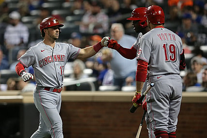 Jul 31, 2021; New York City, New York, USA; Cincinnati Reds shortstop Kyle Farmer (17) celebrates his solo home run against the New York Mets with right fielder Aristides Aquino (44) and first baseman Joey Votto (19) during the fifth inning at Citi Field. Mandatory Credit: Brad Penner-USA TODAY Sports