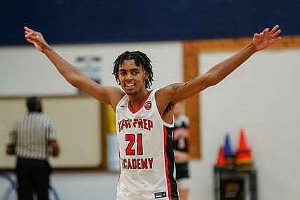 Ypsi Prep forward Emoni Bates (21) celebrates a play against SPIRE Academy during the second half at Central Academy in Ann Arbor, Saturday, March 13, 2021.