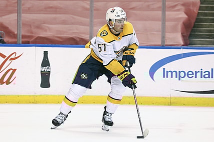 Mar 20, 2021; Sunrise, Florida, USA; Nashville Predators defenseman Dante Fabbro (57) skates with the puck against the Florida Panthers during the second period at BB&T Center. Mandatory Credit: Sam Navarro-USA TODAY Sports