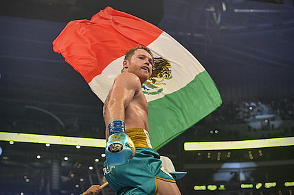 May 8, 2021; Arlington, Texas, USA; Boxer Canelo Alvarez celebrates defeating Billy Joe Saunders during a super middleweight boxing title fight at AT&T Stadium. Mandatory Credit: Jerome Miron-USA TODAY Sports