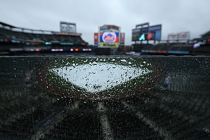May 30, 2021; New York City, New York, USA; General view of a tarp on the field as rain falls at Citi Field. Tonight's game between the New York Mets and the Atlanta Braves has been postponed due to inclement weather. Mandatory Credit: Brad Penner-USA TODAY Sports
