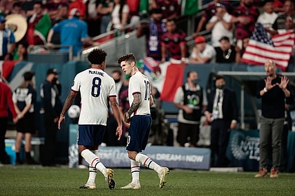 Jun 6, 2021; Denver, Colorado, USA; United States forward Christian Pulisic (10) celebrates with midfielder Weston Mckennie (8) after converting a penalty kick in extra time against Mexico during the 2021 CONCACAF Nations League Finals soccer series final match at Empower Field at Mile High. Mandatory Credit: Isaiah J. Downing-USA TODAY Sports