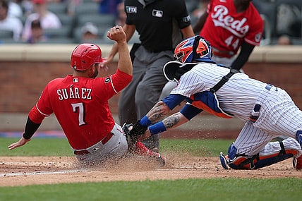 Aug 1, 2021; New York City, New York, USA; Cincinnati Reds third baseman Eugenio Suarez (7) is tagged out at home by New York Mets catcher Tomas Nido (3) while trying to score on a hit by Cincinnati Reds center fielder Tyler Naquin (not pictured) during the fourth inning at Citi Field. Mandatory Credit: Brad Penner-USA TODAY Sports