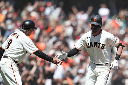 Aug 1, 2021; San Francisco, California, USA; San Francisco Giants third baseman Kris Bryant (23) celebrates with third base coach Ron Wotus (8) after hitting a home run during the third inning against the Houston Astros at Oracle Park. Mandatory Credit: Sergio Estrada-USA TODAY Sports