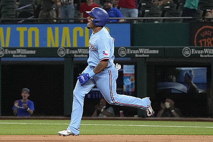 Aug 1, 2021; Arlington, Texas, USA; Texas Rangers second baseman Andy Ibanez (77) celebrates as he rounds the bases on his two-run home run to tie the game against the Seattle Mariners during the ninth inning of a baseball game at Globe Life Field. Mandatory Credit: Jim Cowsert-USA TODAY Sports
