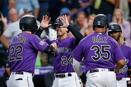 Aug 3, 2021; Denver, Colorado, USA; Colorado Rockies center fielder Sam Hilliard (22) celebrates with third baseman Ryan McMahon (24) and catcher Elias Diaz (35) after hitting a three run home run against the Chicago Cubs in the fourth inning at Coors Field. Mandatory Credit: Isaiah J. Downing-USA TODAY Sports