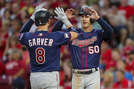 Aug 3, 2021; Cincinnati, Ohio, USA; Minnesota Twins catcher Mitch Garver (8) high fives left fielder Brent Rooker (50) after scoring a three run homer against the Cincinnati Reds during the fifth inning at Great American Ball Park. Mandatory Credit: Katie Stratman-USA TODAY Sports