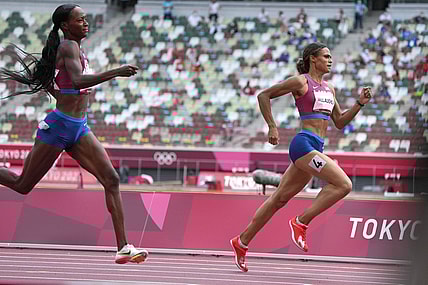 Aug 4, 2021; Tokyo, Japan; Sydney McLaughlin (USA), right, defeats Dalilah Muhammad (USA) to win the women's 400m hurdles n a world record 51.46 to 51.58 during the Tokyo 2020 Olympic Summer Games at Olympic Stadium. Mandatory Credit: Kirby Lee-USA TODAY Sports