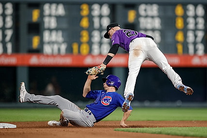 Aug 4, 2021; Denver, Colorado, USA; Chicago Cubs pinch hitter Matt Duffy (5) is tagged out by Colorado Rockies shortstop Trevor Story (27) as he attempts to steal second base in the ninth inning at Coors Field. Mandatory Credit: Isaiah J. Downing-USA TODAY Sports