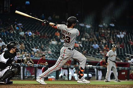 Aug 5, 2021; Phoenix, Arizona, USA; San Francisco Giants third baseman Kris Bryant (23) hits an RBI double in the  tenth inning against the Arizona Diamondbacks at Chase Field. Mandatory Credit: Matt Kartozian-USA TODAY Sports