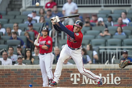 Aug 6, 2021; Cumberland, Georgia, USA; Atlanta Braves first baseman Freddie Freeman (5) singles down the third base line prior to scoring against the Washington Nationals during the first inning at Truist Park. Mandatory Credit: Dale Zanine-USA TODAY Sports