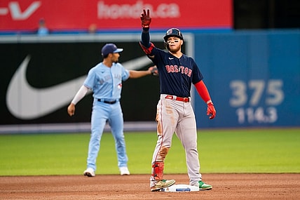 Aug 6, 2021; Toronto, Ontario, CAN; Boston Red Sox left fielder Alex Verdugo (99) celebrates after hitting a double play against the Toronto Blue Jays during the fourth inning at Rogers Centre. Mandatory Credit: Kevin Sousa-USA TODAY Sports