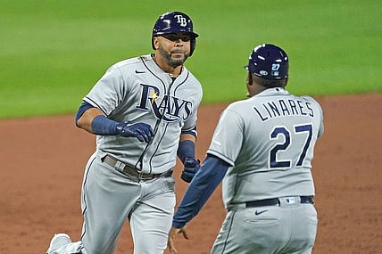 Aug 6, 2021; Baltimore, Maryland, USA; Tampa Bay Rays designated hitter Nelson Cruz (23) greeted by coach Rodney Linares (27) after his three run home run in the sixth inning against the Baltimore Orioles at Oriole Park at Camden Yards. Mandatory Credit: Mitch Stringer-USA TODAY Sports