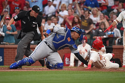 Aug 7, 2021; St. Louis, Missouri, USA; Kansas City Royals catcher Salvador Perez (13) tags out St. Louis Cardinals second baseman Tommy Edman (19) during the fourth inning at Busch Stadium. Mandatory Credit: Joe Puetz-USA TODAY Sports