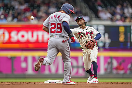 Aug 8, 2021; Cumberland, Georgia, USA; Atlanta Braves second baseman Ozzie Albies (1) throws for a double play past Washington Nationals outfielder Yadiel Hernandez (29) during the first inning at Truist Park. Mandatory Credit: Dale Zanine-USA TODAY Sports