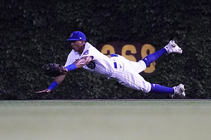 Aug 10, 2021; Chicago, Illinois, USA; Chicago Cubs center fielder Johneshwy Fargas (4) makes a catch on Milwaukee Brewers first baseman Rowdy Tellez (not pictured) during the second inning at Wrigley Field. Mandatory Credit: David Banks-USA TODAY Sports