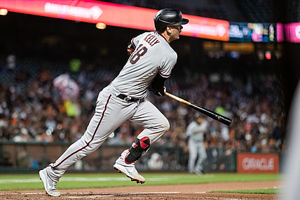 Aug 10, 2021; San Francisco, California, USA; Arizona Diamondbacks catcher Carson Kelly (18) hits a double against the San Francisco Giants in the sixth inning at Oracle Park. Mandatory Credit: John Hefti-USA TODAY Sports
