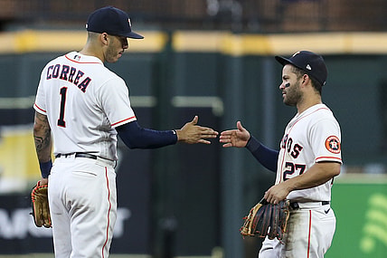 Aug 11, 2021; Houston, Texas, USA; Houston Astros shortstop Carlos Correa (1) and second baseman Jose Altuve (27) celebrate defeating the Colorado Rockies  at Minute Maid Park. Mandatory Credit: Thomas Shea-USA TODAY Sports