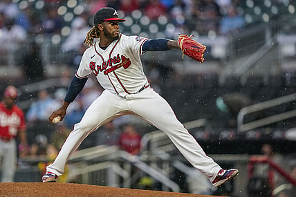 Aug 11, 2021; Cumberland, Georgia, USA; Atlanta Braves starting pitcher Touki Toussaint (62) pitches against the Cincinnati Reds during the first inning at Truist Park. Mandatory Credit: Dale Zanine-USA TODAY Sports