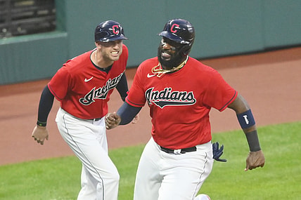 Aug 11, 2021; Cleveland, Ohio, USA; Cleveland Indians third base coach Kyle Hudson (97) yells as designated hitter Franmil Reyes (32) rounds third base before scoring in the first inning against the Oakland Athletics at Progressive Field. Mandatory Credit: David Richard-USA TODAY Sports