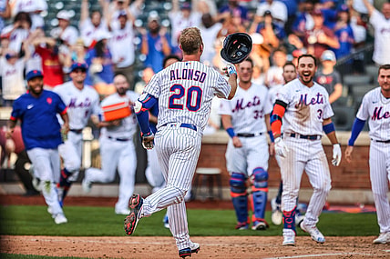 Aug 12, 2021; New York City, NY, USA; New York Mets first baseman Pete Alonso (20) celebrates with teammates  after hitting game winning home run during the eighth inning against the Washington Nationals at Citi Field. Mandatory Credit: Vincent Carchietta-USA TODAY Sports