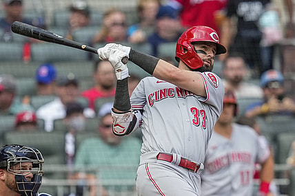 Aug 12, 2021; Cumberland, Georgia, USA; Cincinnati Reds left fielder Jesse Winker (33) hits a grand slam home run against the Atlanta Braves during the second inning at Truist Park. Mandatory Credit: Dale Zanine-USA TODAY Sports