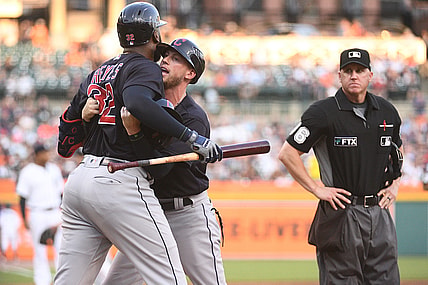 Aug 13, 2021; Detroit, Michigan, USA; Cleveland Indians third base coach Kyle Hudson (97) holds back right fielder Franmil Reyes (32) after being ejected from the game by umpire Ryan Blakney (36) during the third inning against the Detroit Tigers at Comerica Park. Mandatory Credit: Tim Fuller-USA TODAY Sports