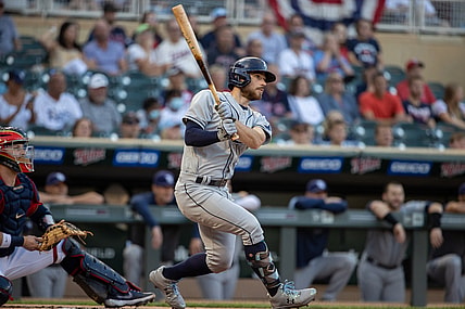 Aug 13, 2021; Minneapolis, Minnesota, USA; Tampa Bay Rays second baseman Brandon Lowe (8) hits a single during the first inning against the Minnesota Twins at Target Field. Mandatory Credit: Jordan Johnson-USA TODAY Sports