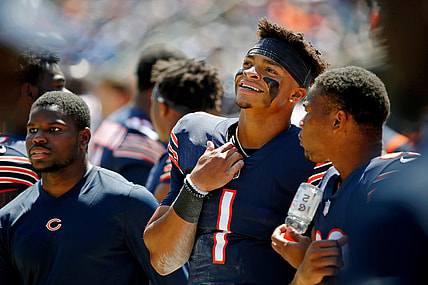 Aug 14, 2021; Chicago, Illinois, USA; Chicago Bears quarterback Justin Fields (1) smiles while watching the game against the Miami Dolphins during the first half at Soldier Field. Mandatory Credit: Jon Durr-USA TODAY Sports