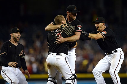 Aug 14, 2021; Phoenix, Arizona, USA; Arizona Diamondbacks starting pitcher Tyler Gilbert (49) celebrates with Arizona Diamondbacks third baseman Drew Ellis (27) and Arizona Diamondbacks catcher Daulton Varsho (12) and Arizona Diamondbacks shortstop Nick Ahmed (13) after throwing a no hitter against the San Diego Padres at Chase Field. Mandatory Credit: Joe Camporeale-USA TODAY Sports