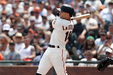 Aug 15, 2021; San Francisco, California, USA; San Francisco Giants second baseman Tommy La Stella (18) hits a two-RBI double during the fifth inning against the Colorado Rockies at Oracle Park. Mandatory Credit: Darren Yamashita-USA TODAY Sports