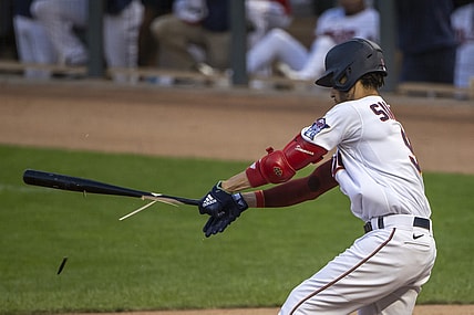 Aug 16, 2021; Minneapolis, Minnesota, USA; Minnesota Twins shortstop Andrelton Simmons (9) hits a ground ball and breaks his bat in the second inning against the Cleveland Indians at Target Field. Mandatory Credit: Jesse Johnson-USA TODAY Sports
