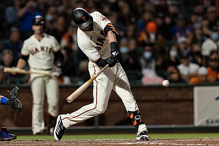 Aug 16, 2021; San Francisco, California, USA; San Francisco Giants third baseman Kris Bryant (23) hits a two-run home run against the New York Mets in the fifth inning at Oracle Park. Mandatory Credit: John Hefti-USA TODAY Sports