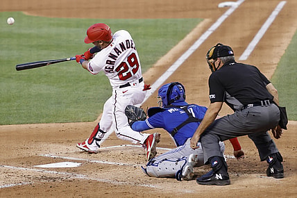 Aug 17, 2021; Washington, District of Columbia, USA; Washington Nationals left fielder Yadiel Hernandez (29) hits a solo home run against the Toronto Blue Jays in the second inning at Nationals Park. Mandatory Credit: Geoff Burke-USA TODAY Sports