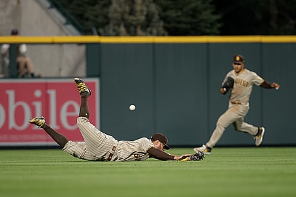 Aug 17, 2021; Denver, Colorado, USA; San Diego Padres left fielder Tommy Pham (28) is unable to field the ball in the fourth inning against the Colorado Rockies at Coors Field. Mandatory Credit: Isaiah J. Downing-USA TODAY Sports