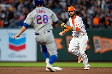 Aug 17, 2021; San Francisco, California, USA;  San Francisco Giants shortstop Brandon Crawford (35) starts the double play as New York Mets third baseman J.D. Davis (28) slides into second base during the fourth inning at Oracle Park. Mandatory Credit: Neville E. Guard-USA TODAY Sports