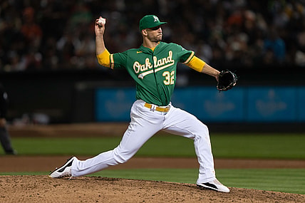 Aug 20, 2021; Oakland, California, USA;  Oakland Athletics pitcher James Kaprielian (32) pitches during the fifth inning against the San Francisco Giants at RingCentral Coliseum. Mandatory Credit: Stan Szeto-USA TODAY Sports