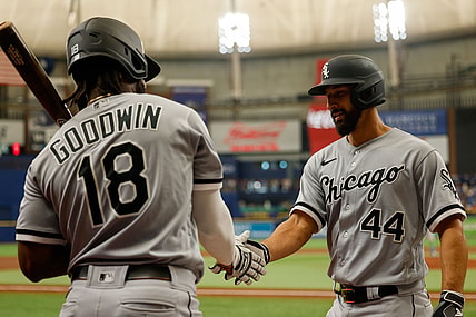 Aug 21, 2021; St. Petersburg, Florida, USA;  Chicago White Sox center fielder Brian Goodwin (18) congratulates catcher Seby Zavala (44) after hitting a home run in the third inning against the Tampa Bay Rays at Tropicana Field. Mandatory Credit: Nathan Ray Seebeck-USA TODAY Sports