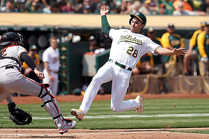 Aug 21, 2021; Oakland, California, USA; Oakland Athletics first baseman Matt Olson (28) slides into home plate to score a run as San Francisco Giants catcher Curt Casali (2) waits for a throw during the third inning at RingCentral Coliseum. Mandatory Credit: Darren Yamashita-USA TODAY Sports