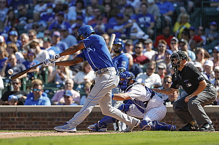 Aug 22, 2021; Chicago, Illinois, USA; Kansas City Royals center fielder Michael A. Taylor (2) hits a sacrifice fly against the the Chicago Cubs during the fifth inning at Wrigley Field. Mandatory Credit: Kamil Krzaczynski-USA TODAY Sports