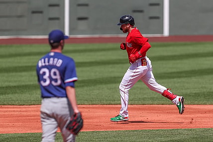 Aug 23, 2021; Boston, Massachusetts, USA; Boston Red Sox center fielder Alex Verdugo (99) hits a home run during the second inning against the Texas Rangers at Fenway Park. Mandatory Credit: Paul Rutherford-USA TODAY Sports