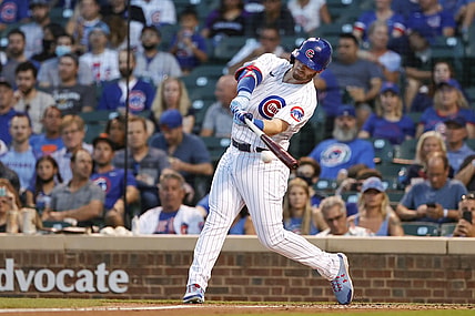 Aug 23, 2021; Chicago, Illinois, USA; Chicago Cubs center fielder Ian Happ (8) doubles against the Colorado Rockies during the first inning at Wrigley Field. Mandatory Credit: Kamil Krzaczynski-USA TODAY Sports
