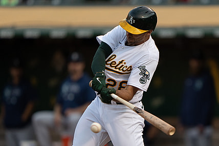 Aug 23, 2021; Oakland, California, USA;  Oakland Athletics first baseman Matt Olson (28) hits a single against the Seattle Mariners during the first inning at RingCentral Coliseum. Mandatory Credit: Stan Szeto-USA TODAY Sports