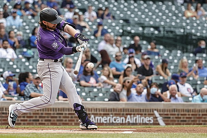 Aug 25, 2021; Chicago, Illinois, USA; Colorado Rockies shortstop Brendan Rodgers (7) hits a two-run home run against the Chicago Cubs during the first inning in game two of a doubleheader at Wrigley Field. Mandatory Credit: Kamil Krzaczynski-USA TODAY Sports
